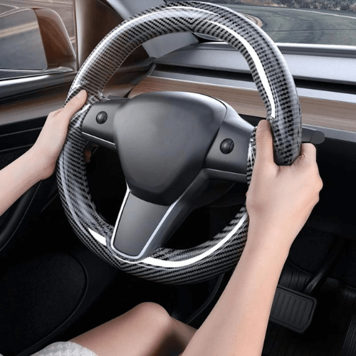 Couvre volant en fibre de carbone pour Tesla Model 3 et Model Y, offrant confort et style.