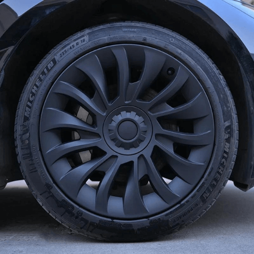 Enjoliveur 18 pouces Tesla Model 3 avec design élégant, en plastique ABS, monté sur pneu Michelin.