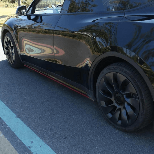 Tesla Model Y with stylish 20-inch wheel covers showcasing sleek design and modern aesthetics.