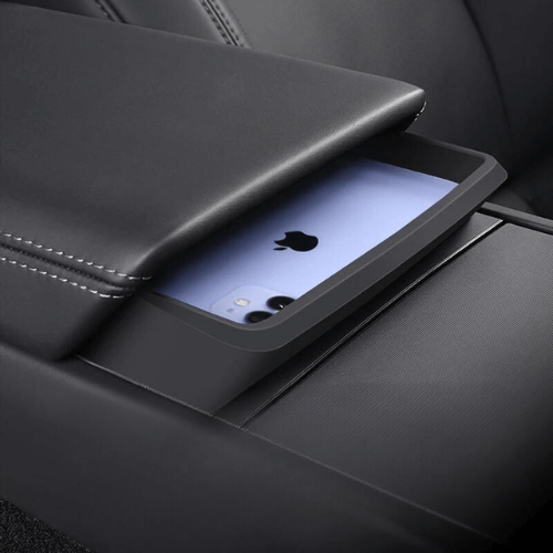 Support de porte lunettes élégant pour Tesla, intégrant un design fonctionnel dans la console centrale du véhicule.