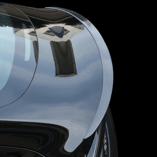 Close-up of Becquet spoiler on Tesla Model 3 Highland highlighting aerodynamic design and sleek finish.