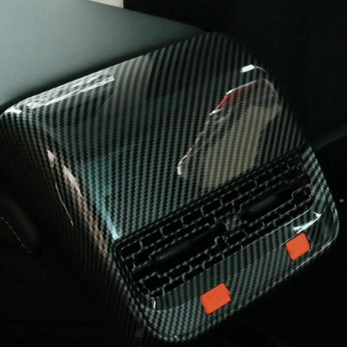 Covering aérateur arrière pour Tesla, en finition carbone, ajouté pour style et protection des aérateurs.