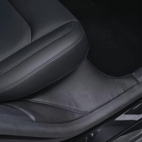Close-up of a sleek black seat in a Tesla Model Y, showcasing quality protection and comfort.