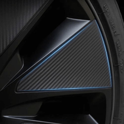 Close-up of black carbon covering enjoliveurs with blue accents for Tesla Model 3 Highland.