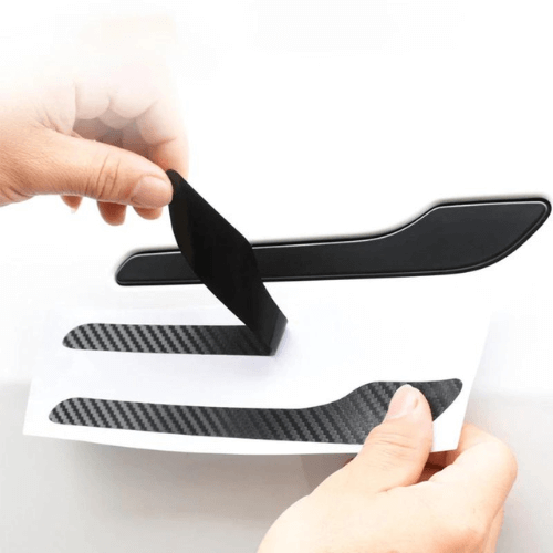 Applying door handle covering for Tesla Model 3 or Y; enhancing style and protection with high-quality materials.