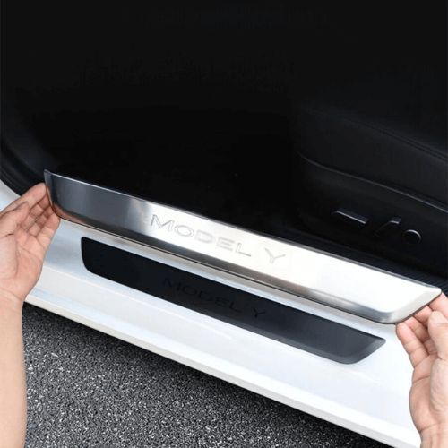 Installation of LED illuminated door sill for Tesla Model Y, enhancing style and functionality.