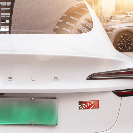 Tesla Model S rear view with Launch Edition emblem sticker for customization, showcasing sleek design.