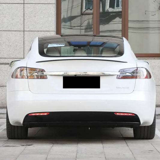 Tesla vehicle showcasing stylish LED rear position lights for improved visibility and modern aesthetics.