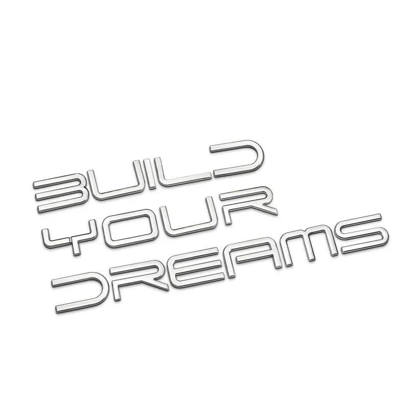 Metallic letters spelling 'Build Your Dreams' for vehicle customization and personalization.