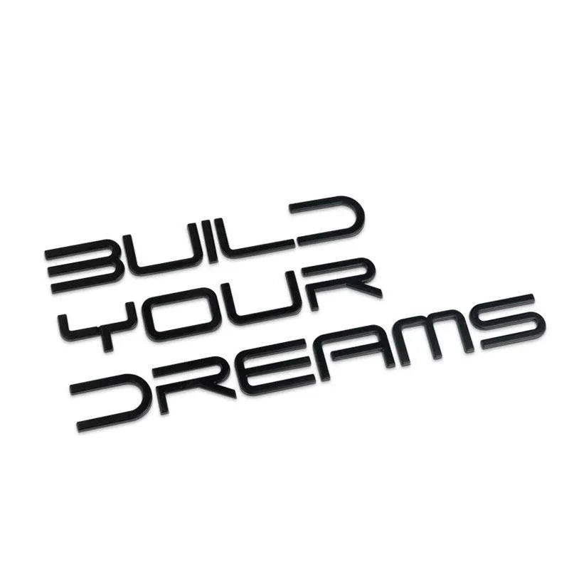 Text graphic saying 'Build Your Dreams' in bold black letters on a white background.