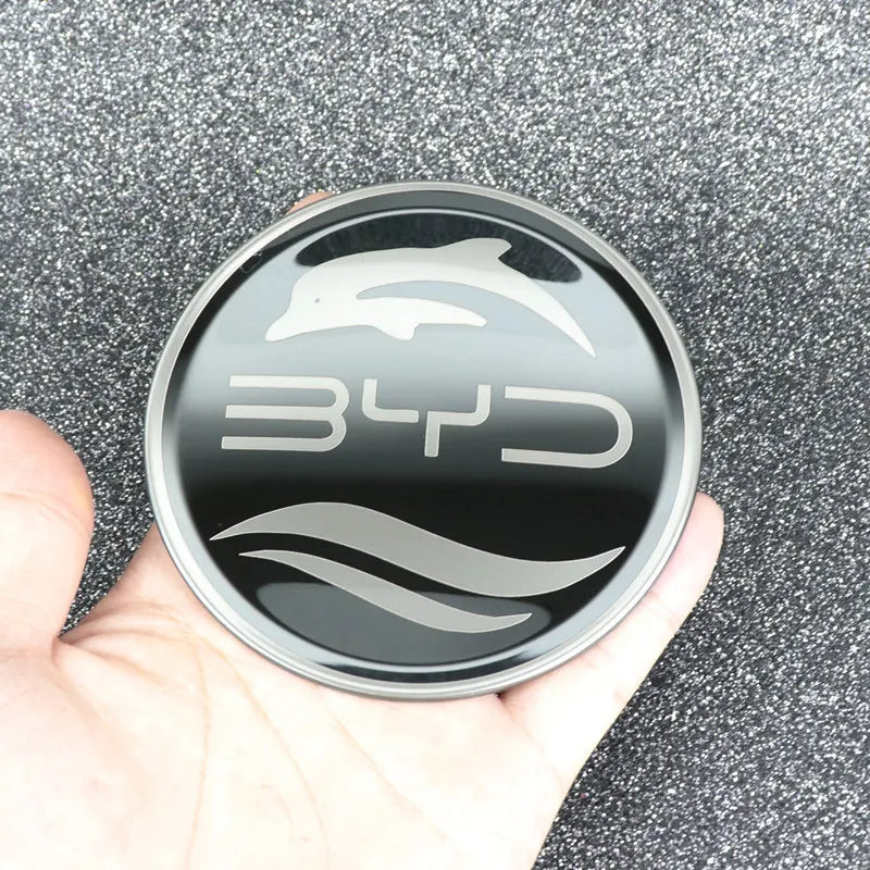 Emblème de volant BYD en inox avec logo de dauphin et finition élégante pour personnaliser votre véhicule.