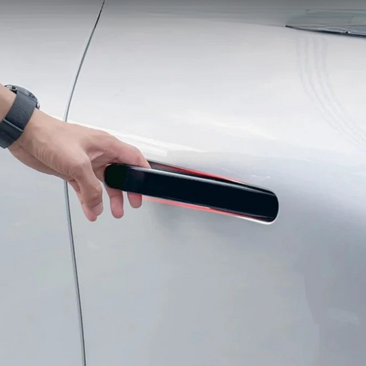 Person using an exterior handle cover on an XPeng G6, showcasing style and protection for 2024 model.